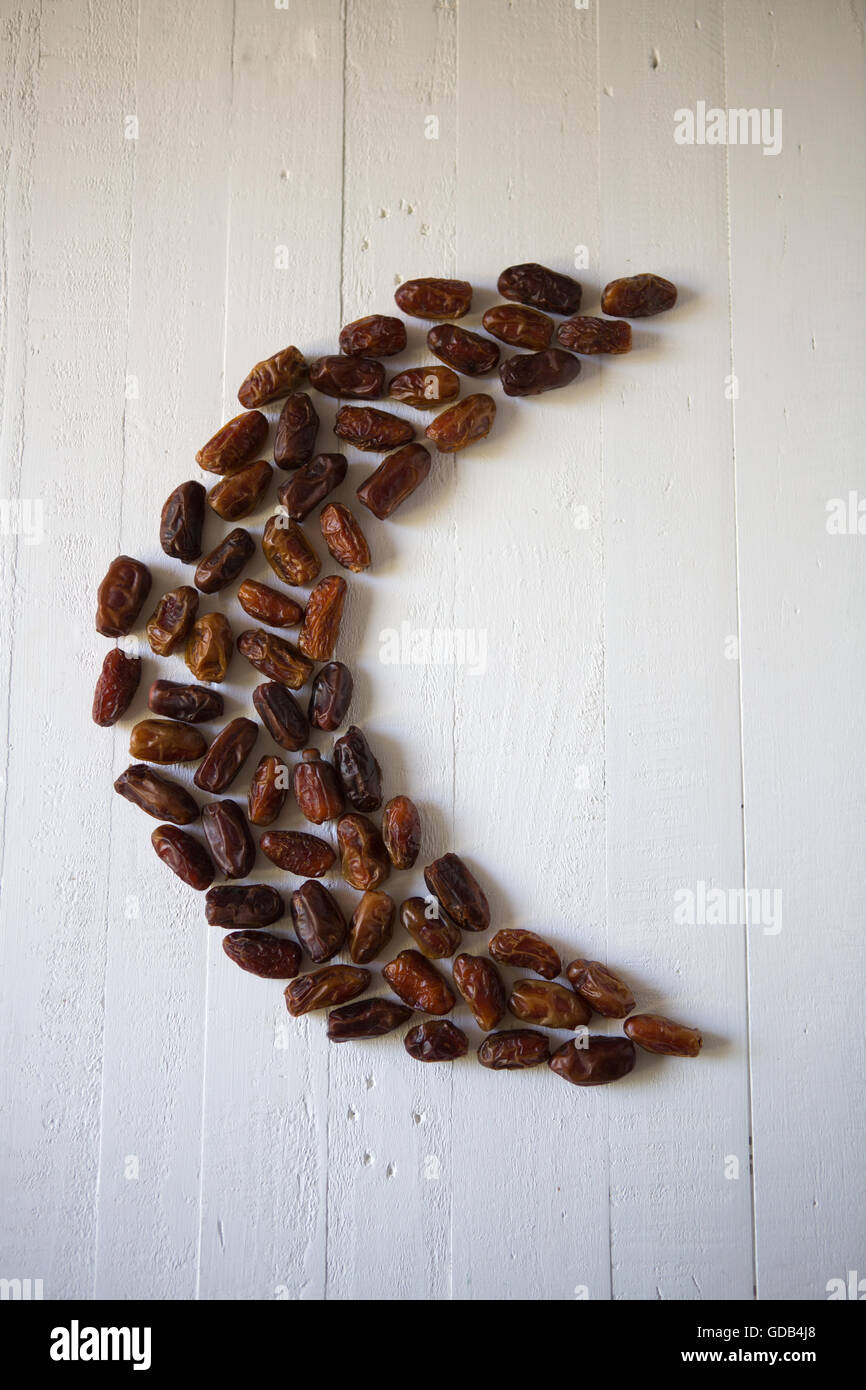 Dates in the shape of a crescent moon, a symbol of Ramadan in Islam ...