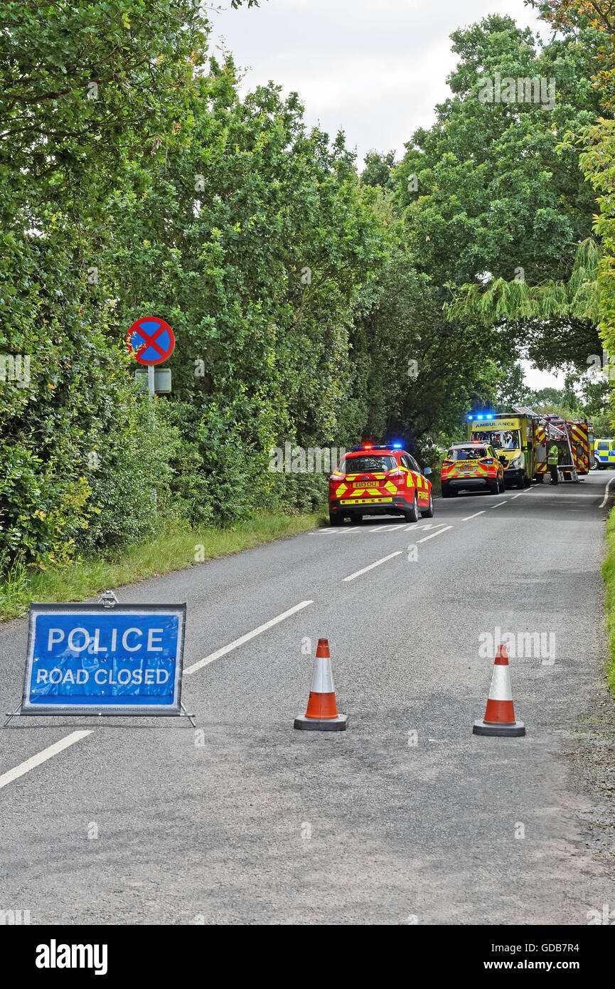 Scene of a road accident on a rural road in the UK. Emergency services attending. Stock Photo
