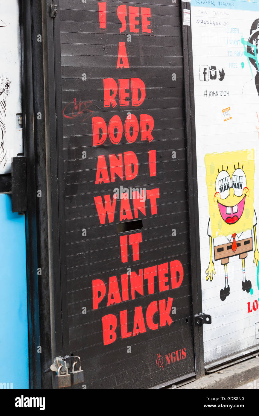 I see a red door and I want it painted black - lyrics from Rolling Stones  hit Paint it Black - on door in London Stock Photo - Alamy