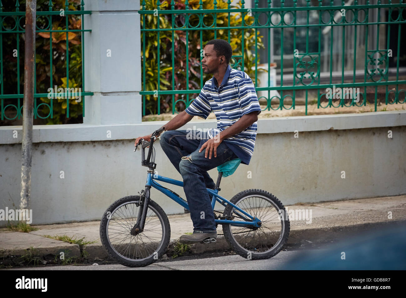 The Lesser Antilles Barbados Parish Saint Michael west indies Bridgetown young black male man youth riding a BMX bike bicycle je Stock Photo