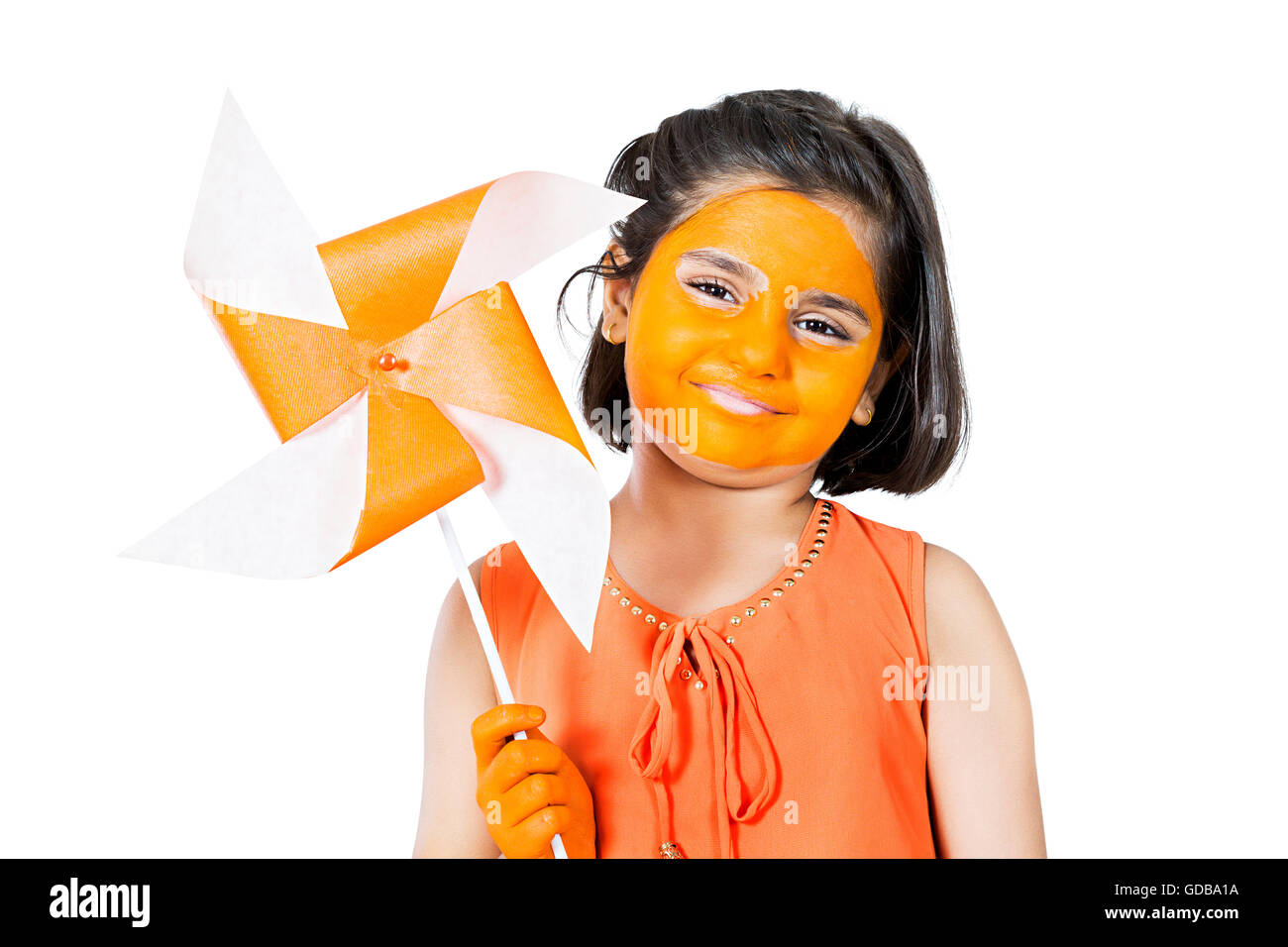 1 indian Kid girl face paint Standing and showing Pinwheel Stock Photo
