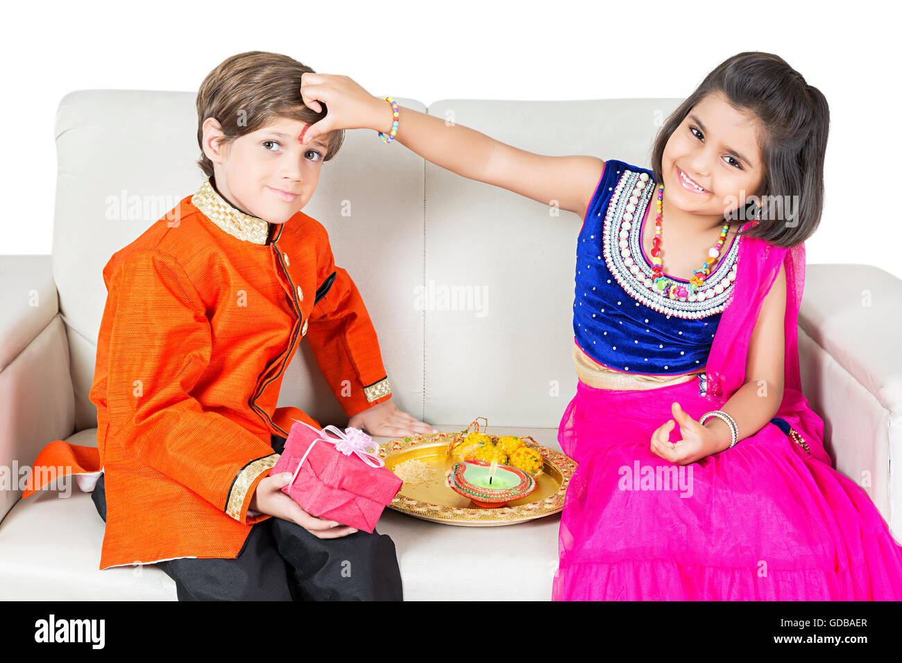 2 indians Kids brother and sister Raksha Bandhan Festival Applying Tika Stock Photo