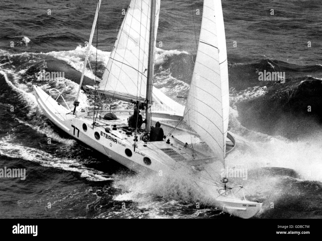 AJAX NEWS PHOTOS. 6TH JUNE, 1981. PLYMOUTH, ENGLAND.  - TWO HANDED TRANSAT - ETERNA ROYAL QUARTZ, LIGHTWEIGHT FRENCH PROA-CATAMARAN ENTRY IN THE TWO HANDED TRANSATLANTIC RACE POUNDS INTO HEAVY SEAS AS CREW MEMBERS JEAN MARIE VIDAL AND ELLIE AIGON STRUGGLE TO TRIM SAIL ON THEIR FRAIL VESSEL.  PHOTO:JONATHAN EASTLAND/AJAX  REF:YA ETERNA ROYAL QUARTZ 1981 Stock Photo