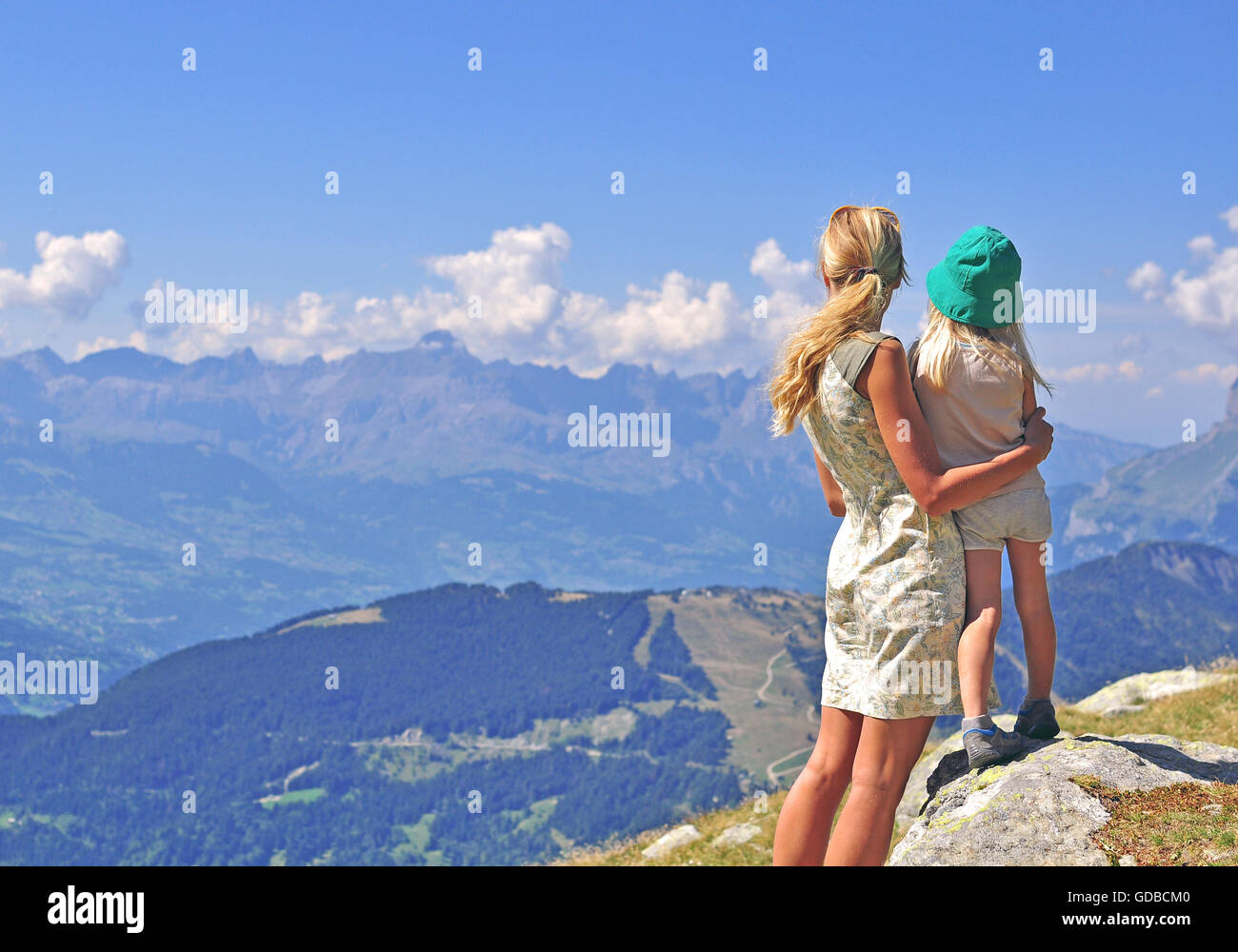 Mum with a child in mountains Stock Photo
