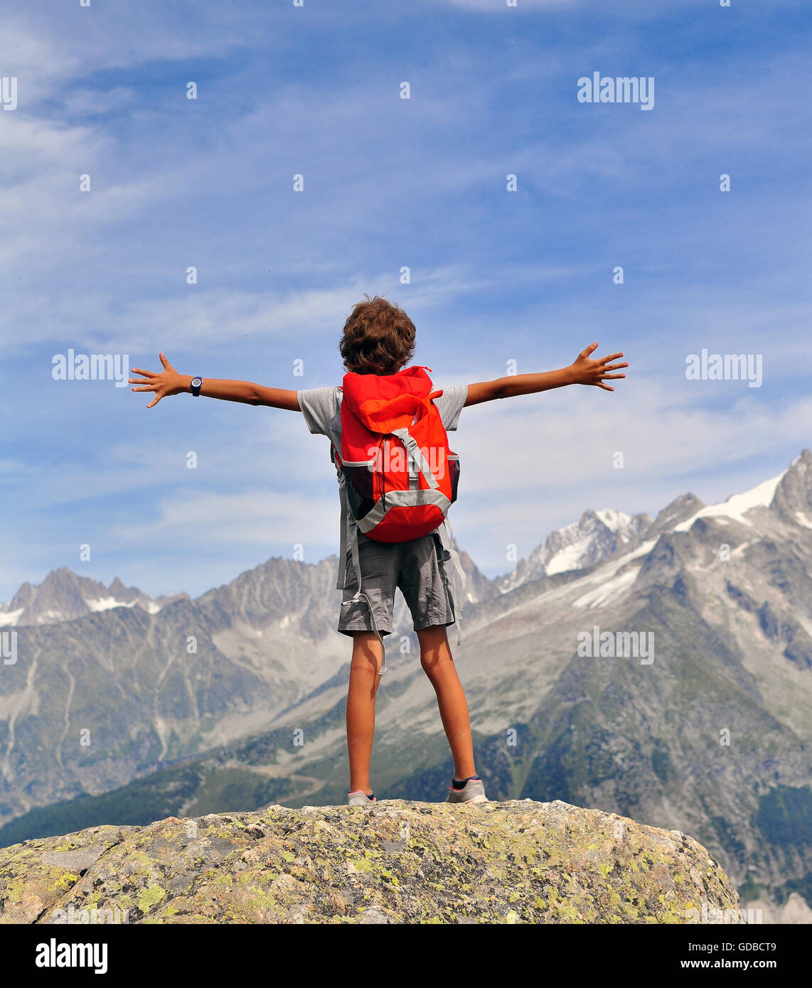 Boy looking at mountains, Chamonix Mont Blanc, France Stock Photo
