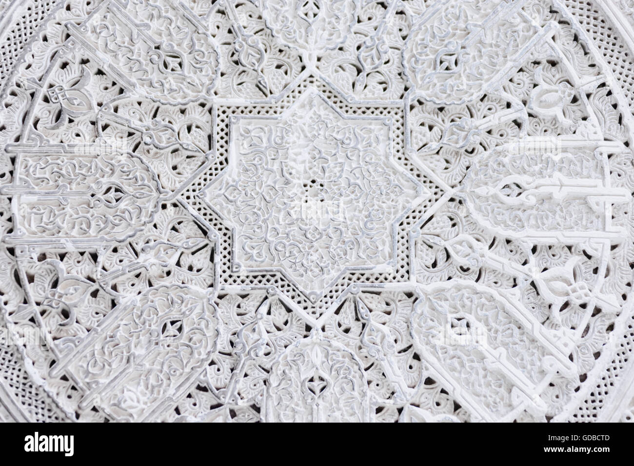 Carved ceiling inside the medersa el-Attarine in Fès, Morocco. Stock Photo