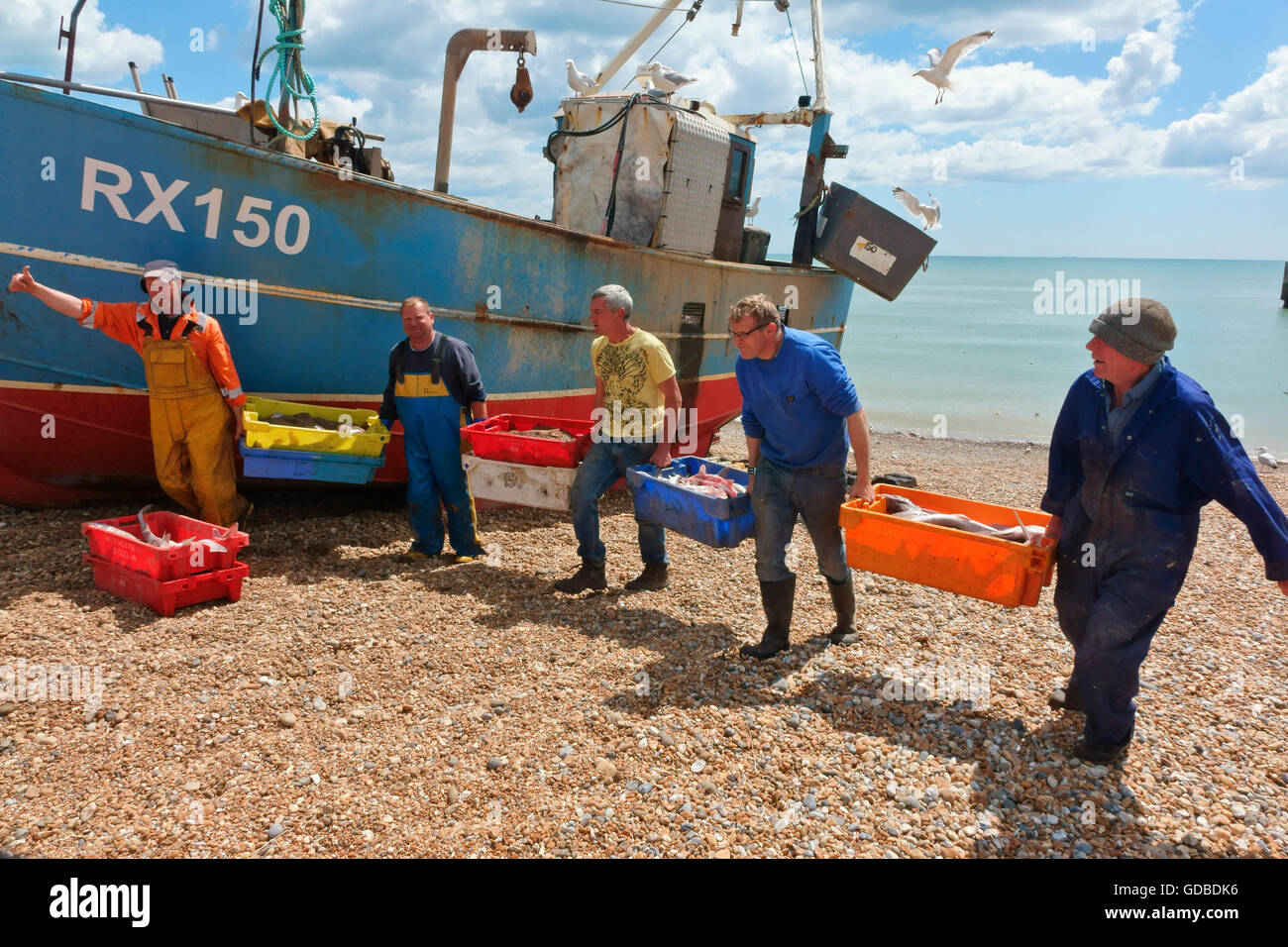 Hastings fishermen unloading catch of fish East Sussex England Britain