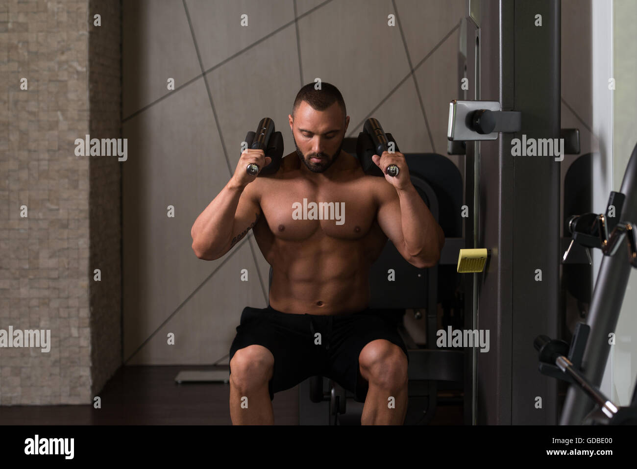 Big Man Using A Press Machine In A Fitness Club Dont Skip Leg Day Stock Photo Alamy