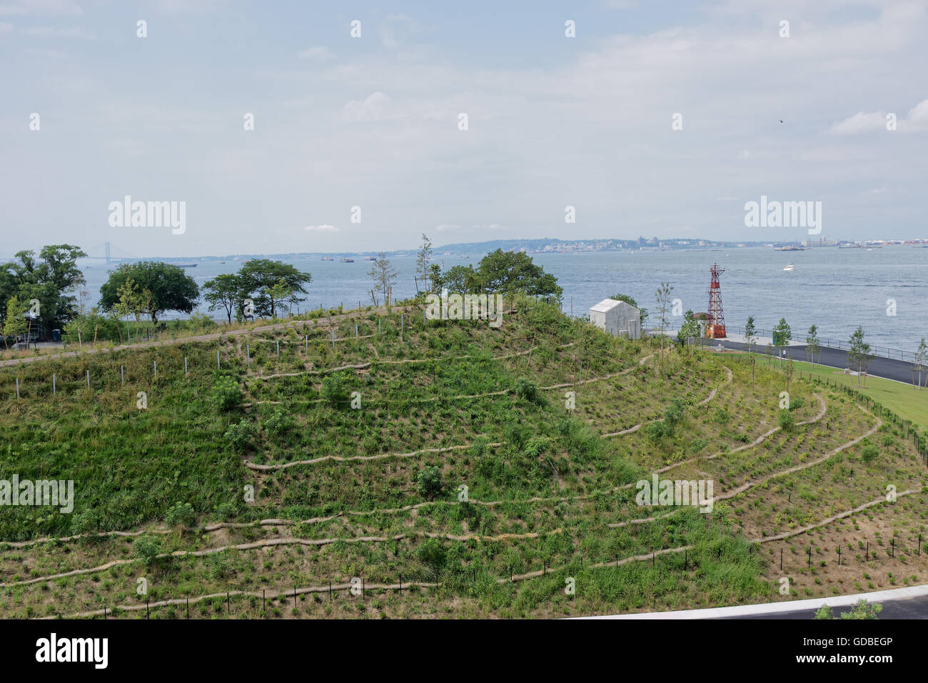 Governors Island’s Discovery Hill overlooking New York harbor is one of four man-made hills on the island, designed by West 8. Stock Photo