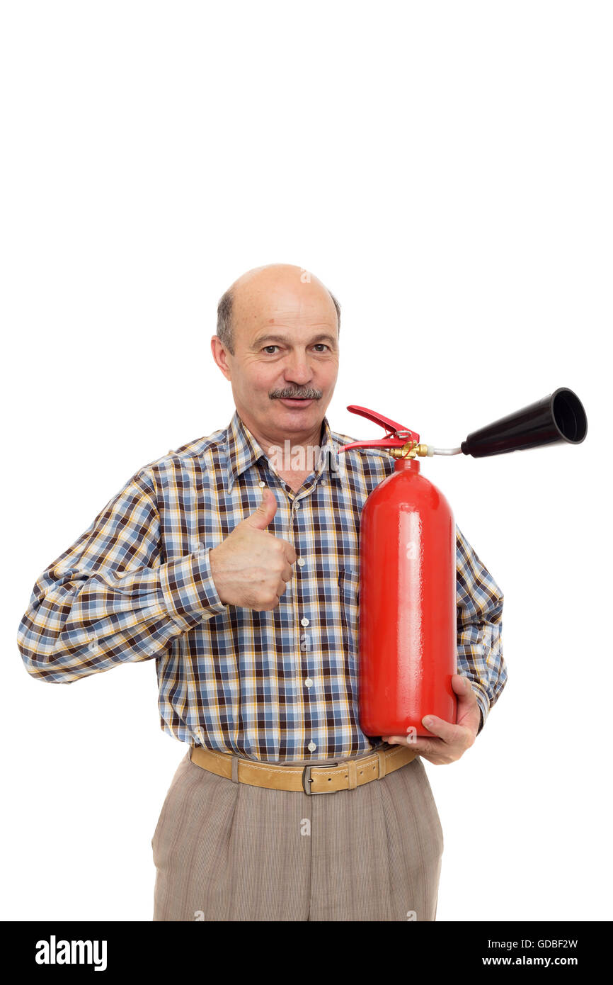 elderly man is holding fire extinguisher. Observance of rules of fire safety Stock Photo