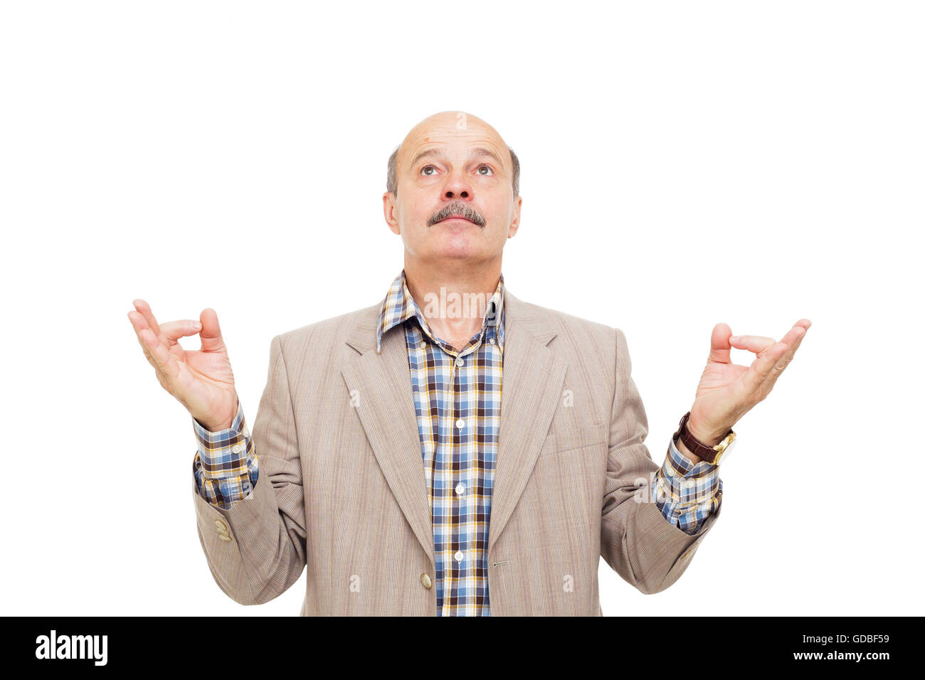 Elderly manager in a business suit meditating. Fingers in form of yoga hand position Stock Photo