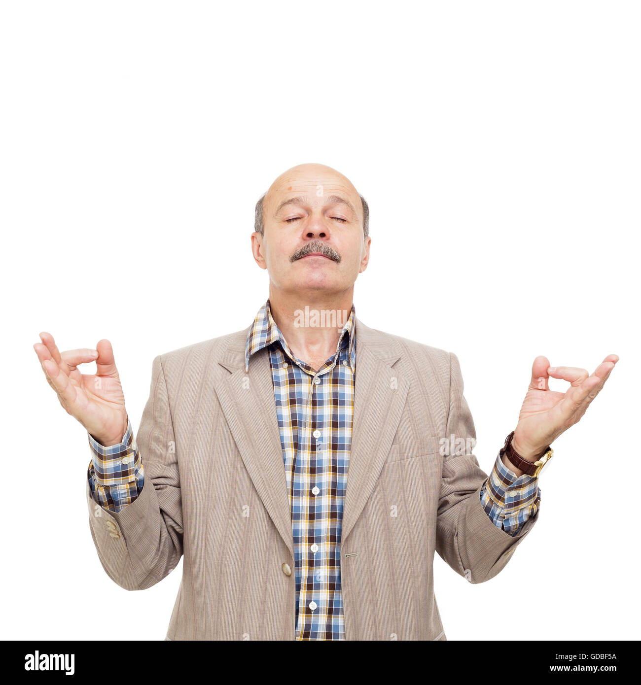 Elderly manager in a business suit meditating. Fingers in form of yoga hand position Stock Photo