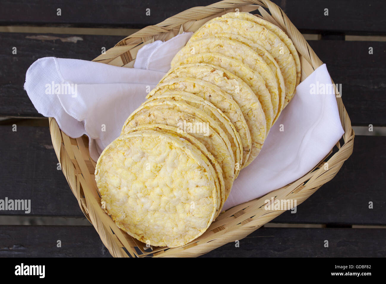 Crunchy round puffed corn cakes snacks on rustic background Stock Photo