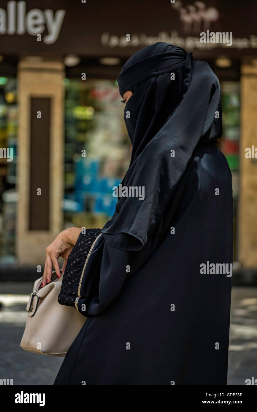 Veiled Muslim Woman Shopping Stock Photo