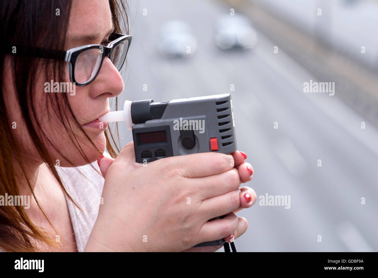 woman investigating on alkom alcohol level Stock Photo