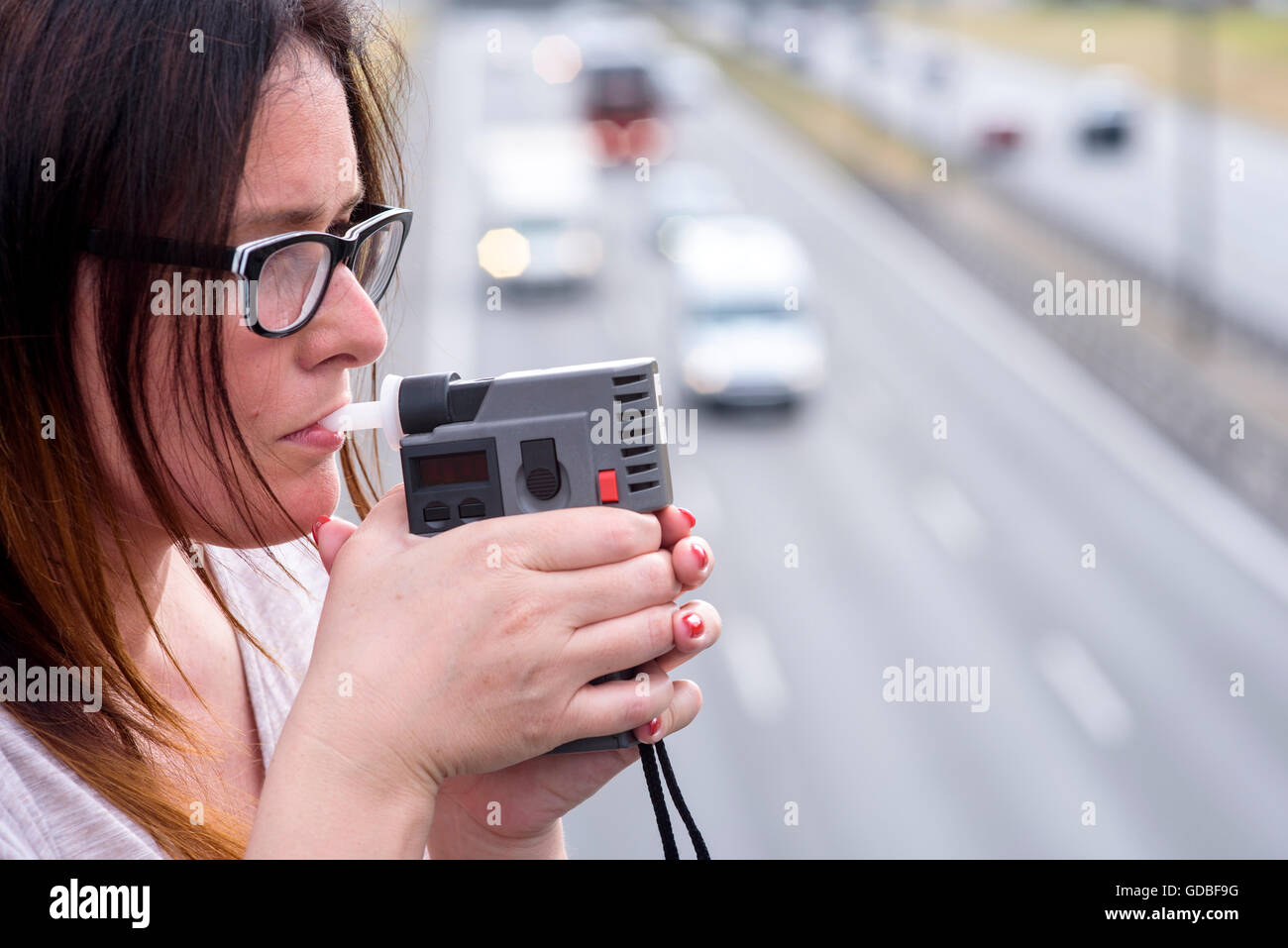 woman investigating on alkom alcohol level Stock Photo