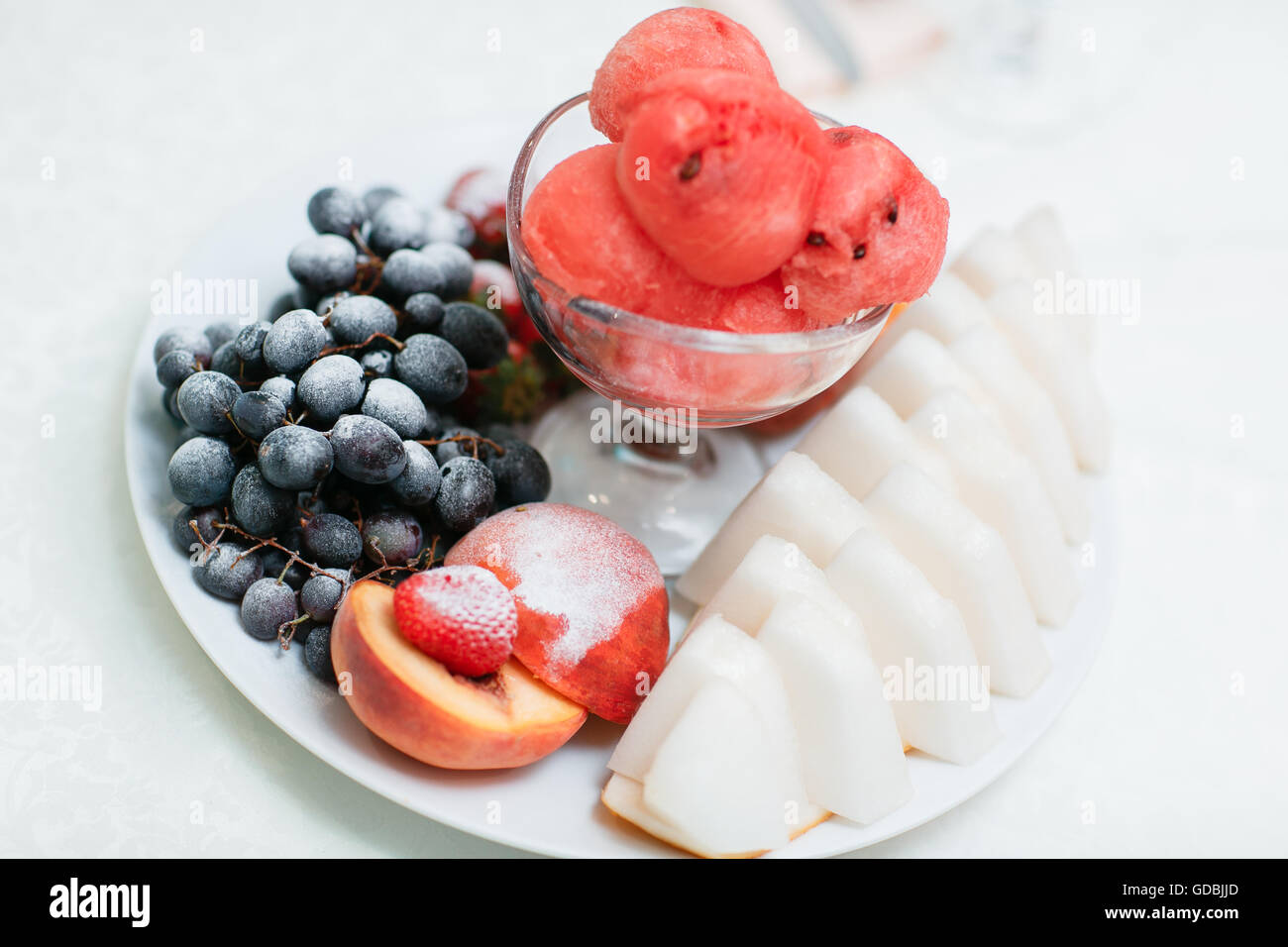 ripe sliced watermelon and melon grapes strawberries Stock Photo Alamy
