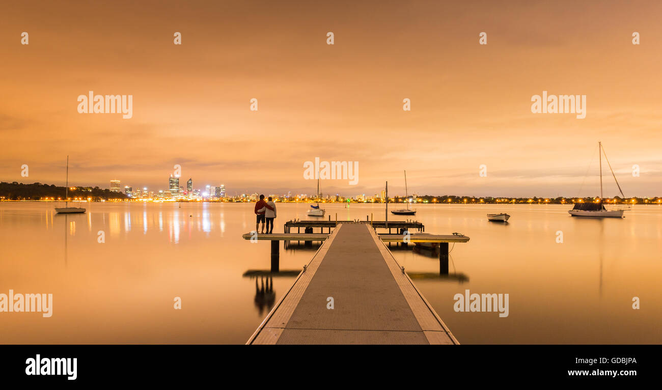 A couples are watching sunrise at Matilda Bay, Western Australia, Australia Stock Photo