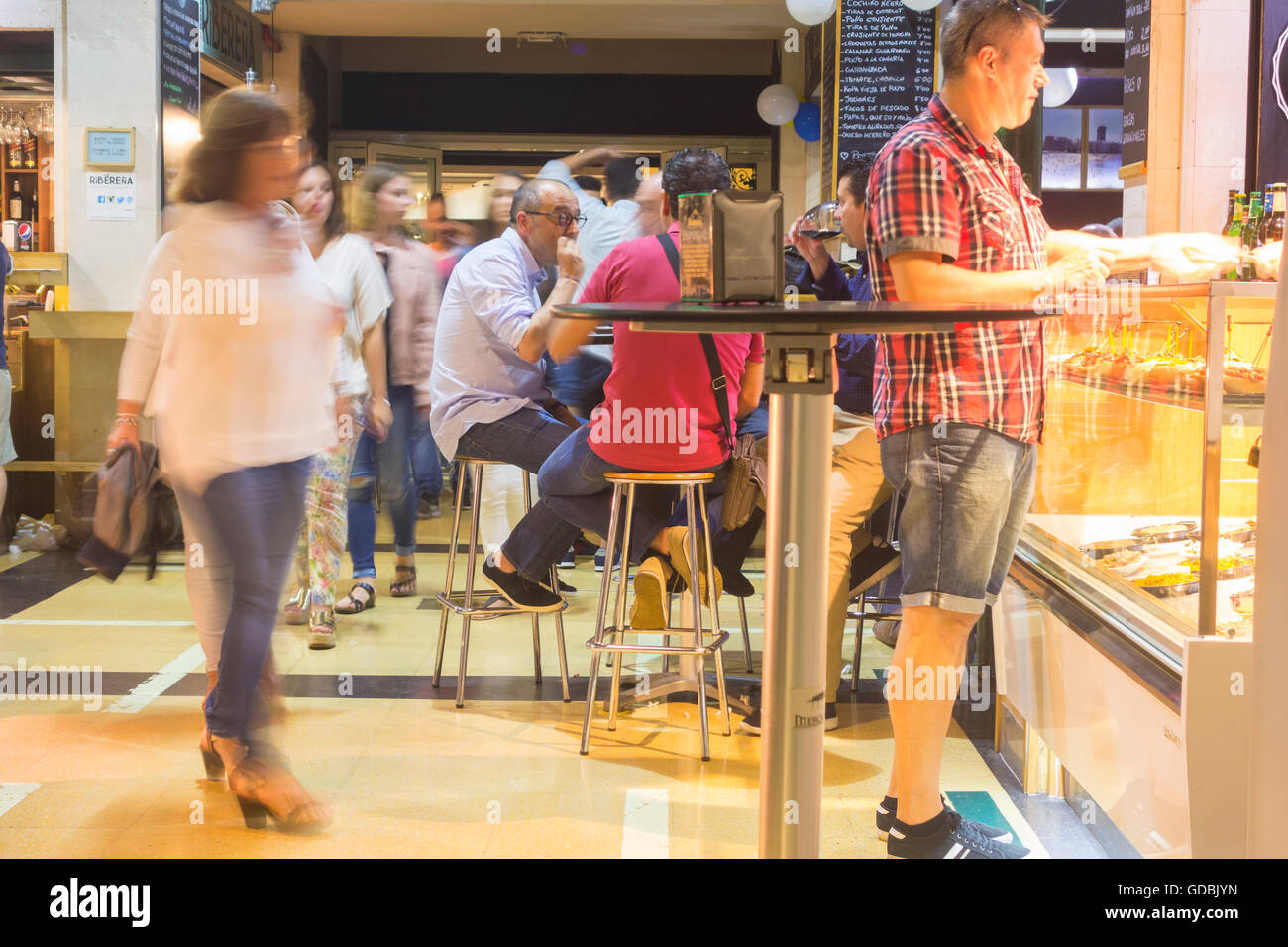 People eating and drinking at bars inside Mercado del Puerto (port market) in Las Palmas, Gran Canaria, Canary Islands, Spain Stock Photo