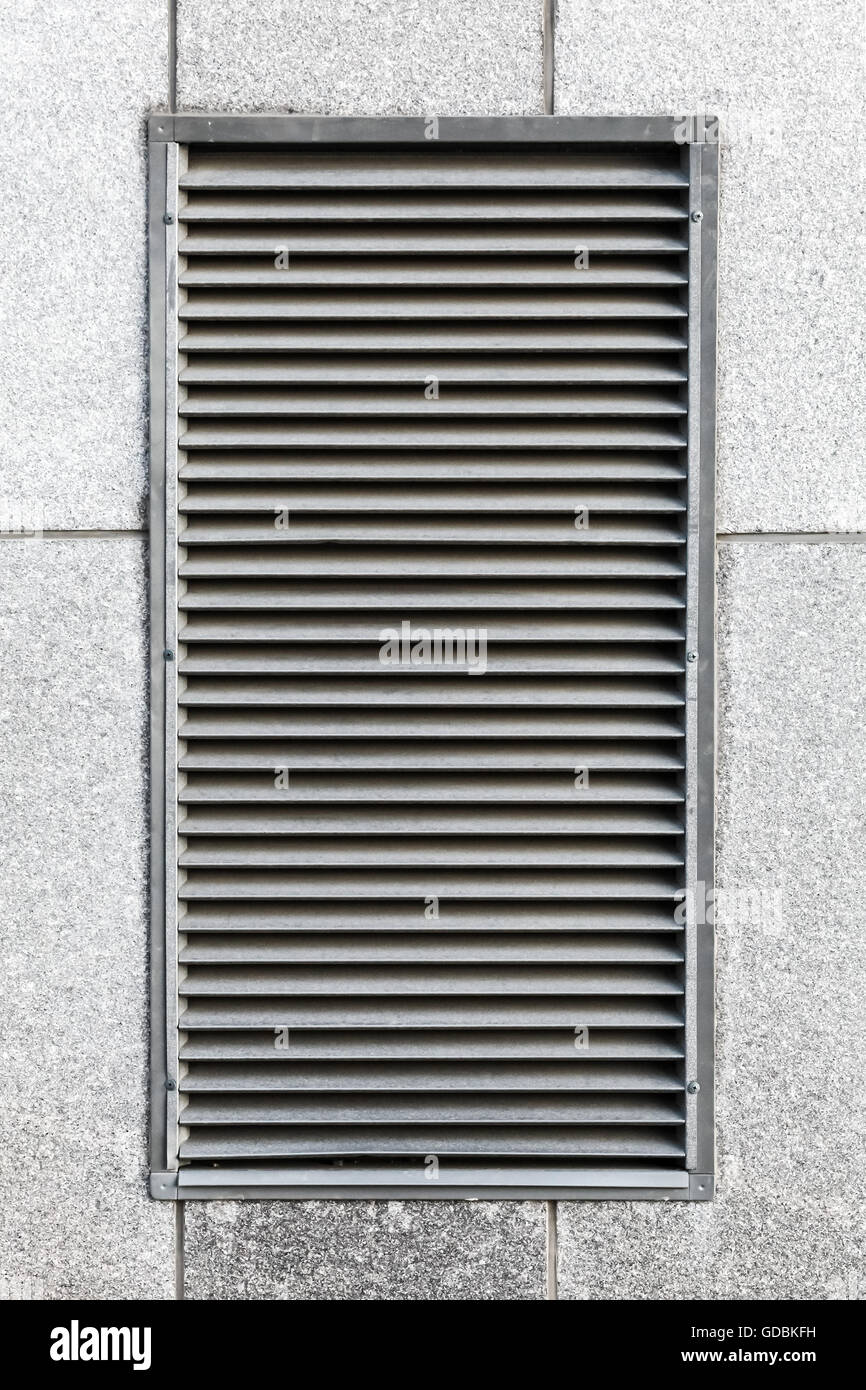 Metal ventilation grille in gray industrial wall, close up photo texture Stock Photo
