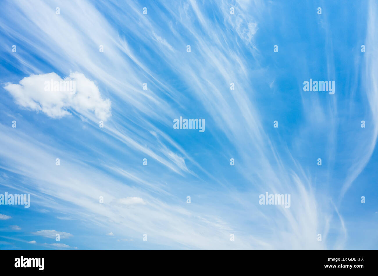 Cirrus clouds in blue windy sky, natural background photo Stock Photo