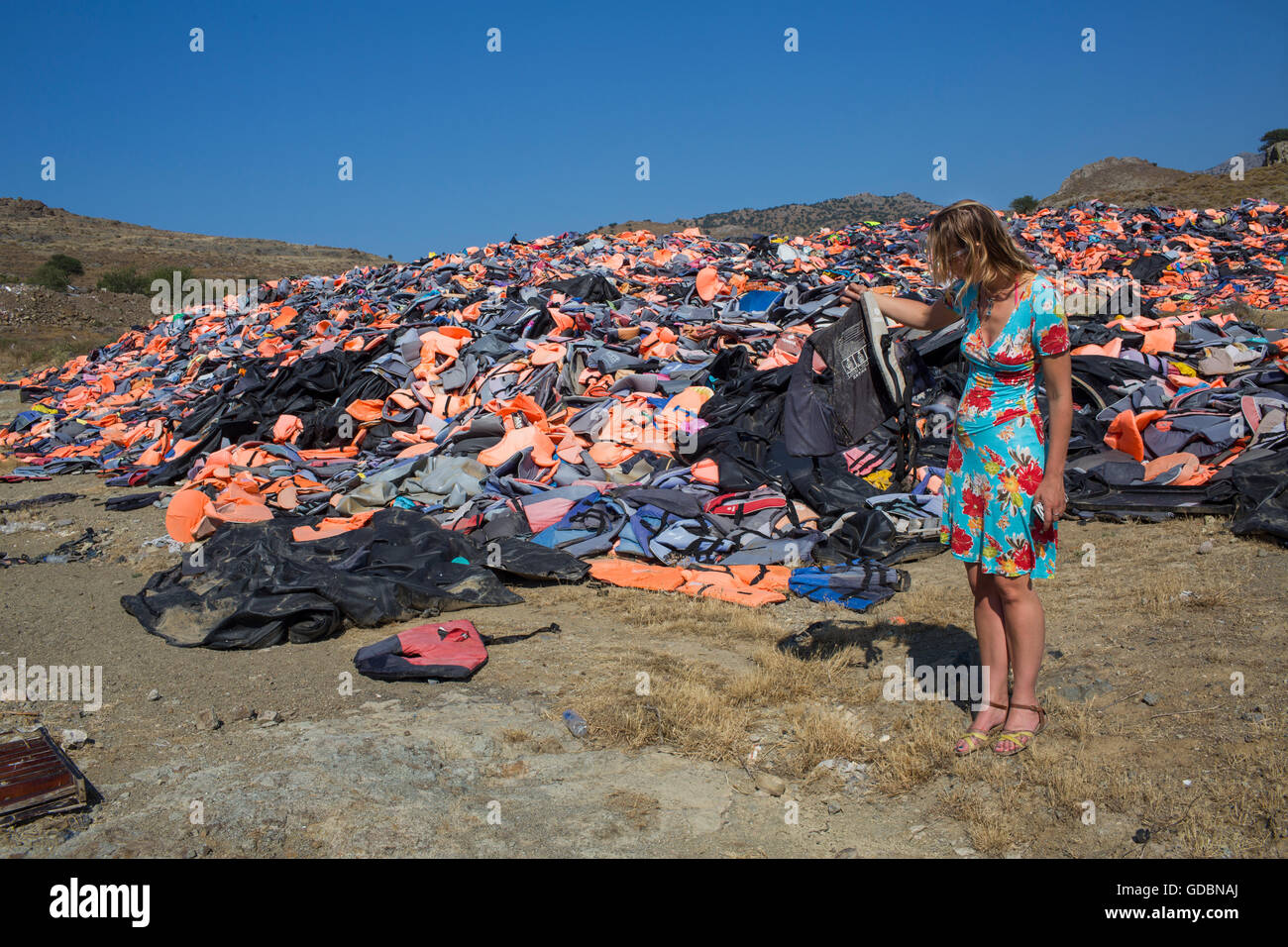 life jackets used by refugees to cross from Turkey to Greece. They are  collected and dumped at the waste pit at Lesbos Stock Photo - Alamy