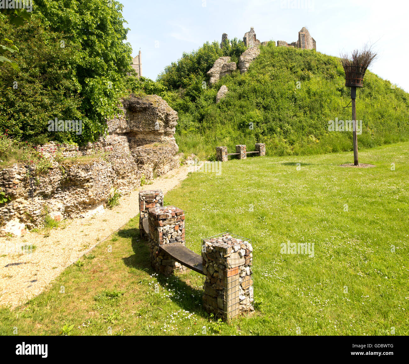 Norman motte and bailey castle with Victorian building ruin Eye, Suffolk, England, UK Stock Photo