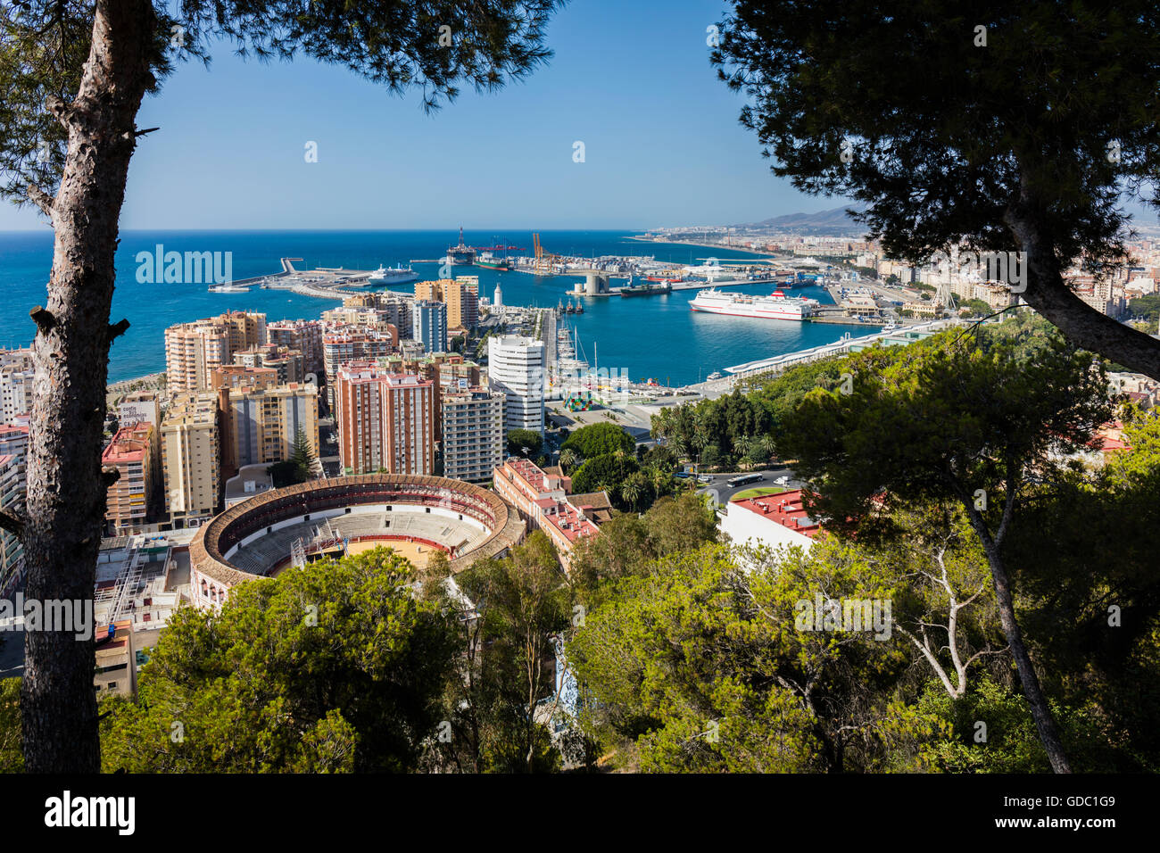 Malaga, Costa del Sol, Malaga Province, Andalusia, southern Spain.  Overall view of bullring and port from National Parador Stock Photo