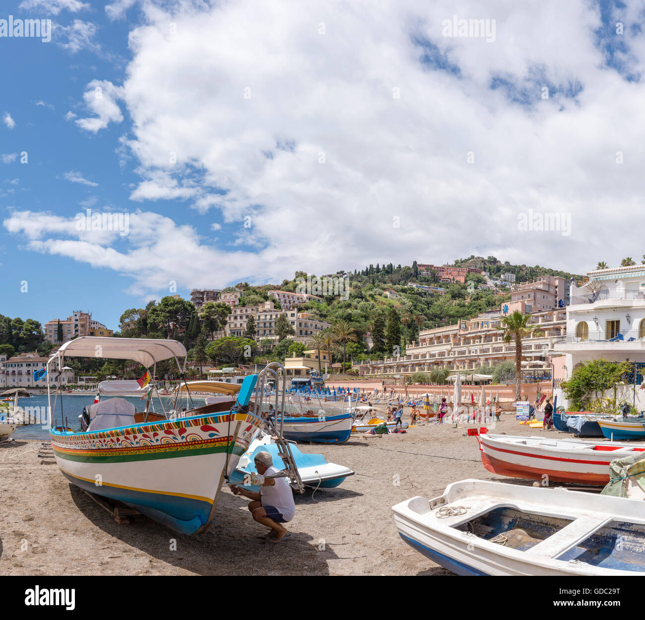 Hotels,beach with fishing boats at the bay of Mazzaro Stock Photo