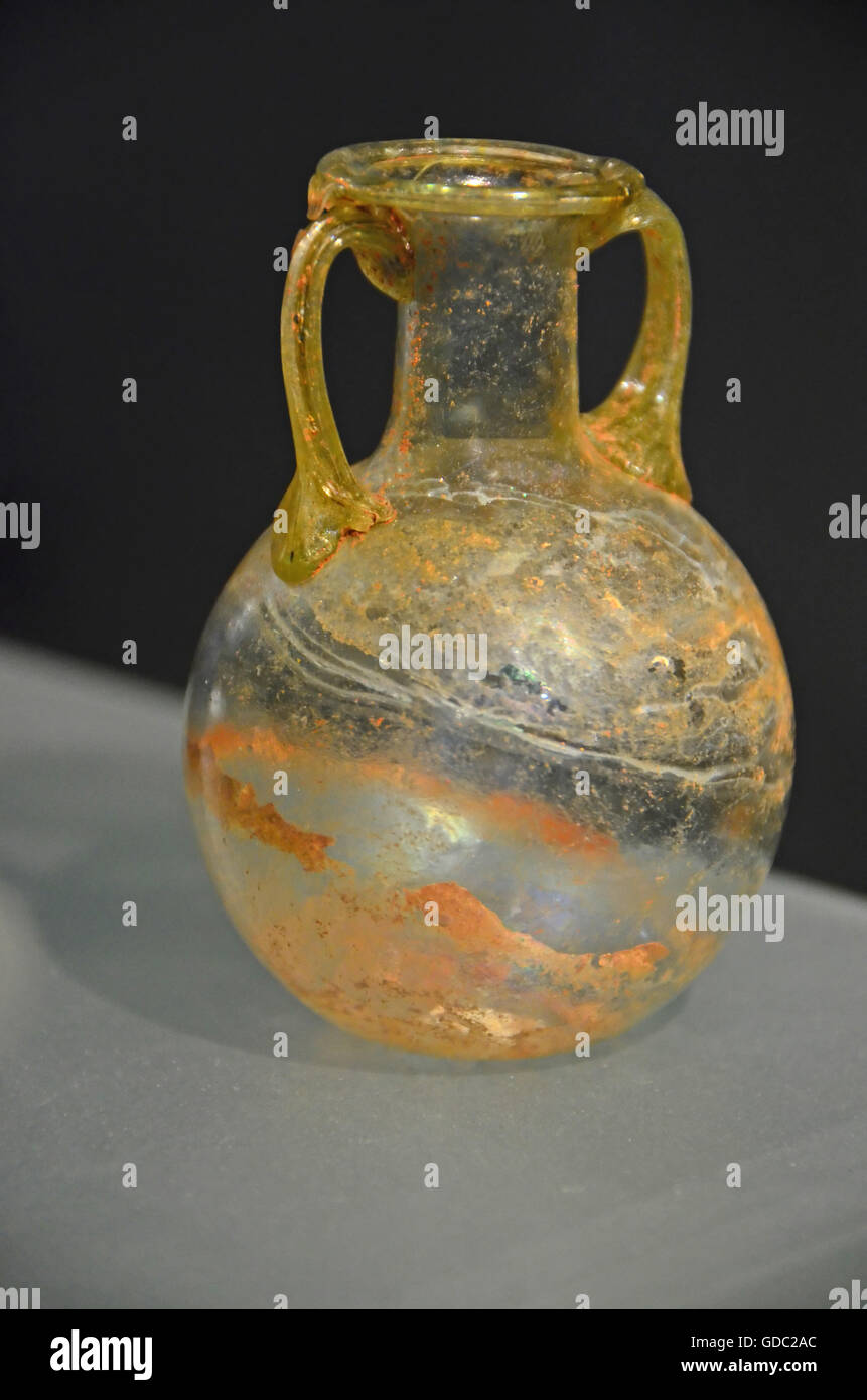 Ancient roman elegant glass vase with attractive golden veining and golden handles Stock Photo