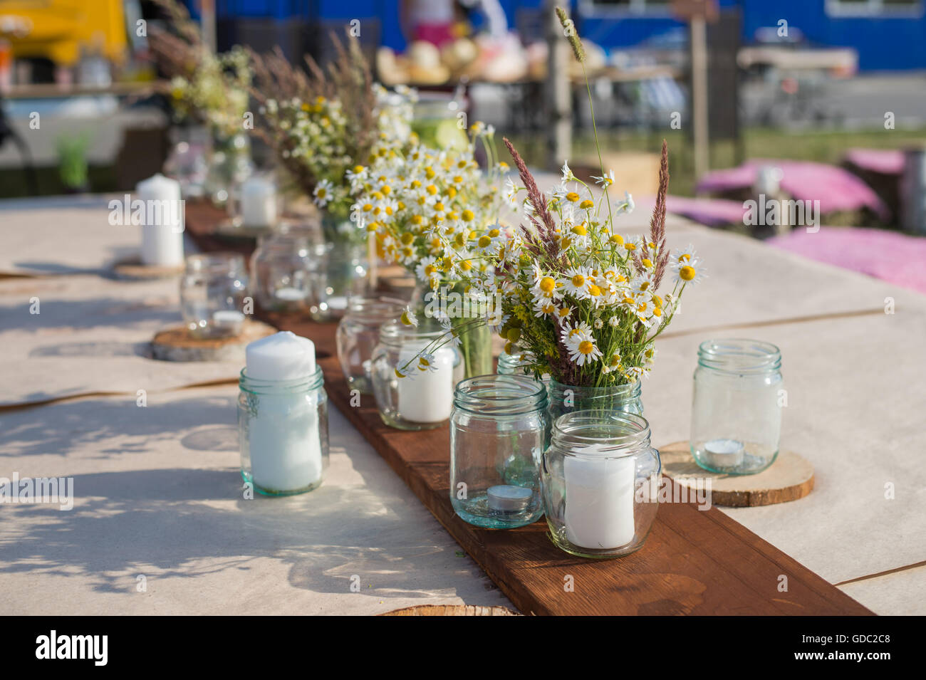 Beautiful table set with candles and flowers for a festive event, party or wedding reception Stock Photo