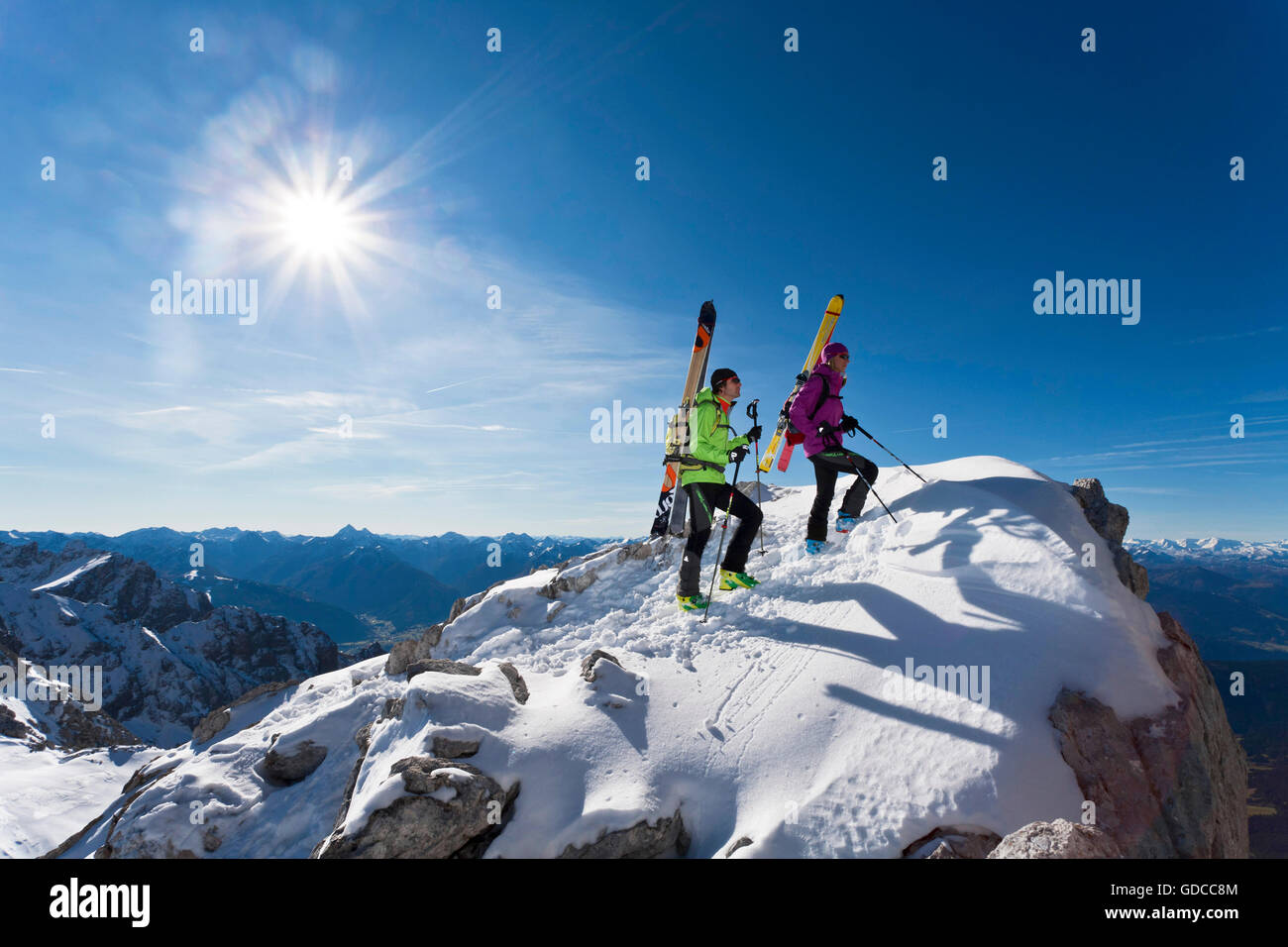 Ski tour,man,woman,couple,winter,sport,Dachstein,Styria,Austria,summit,peak,sun,mountain Stock Photo