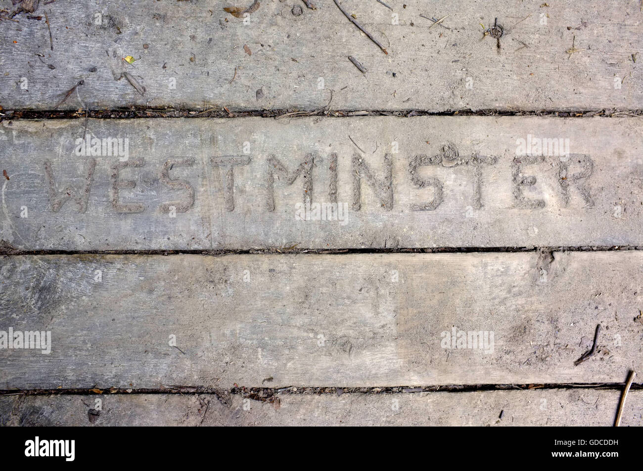 Westminster carved into a wooden plank Stock Photo Alamy