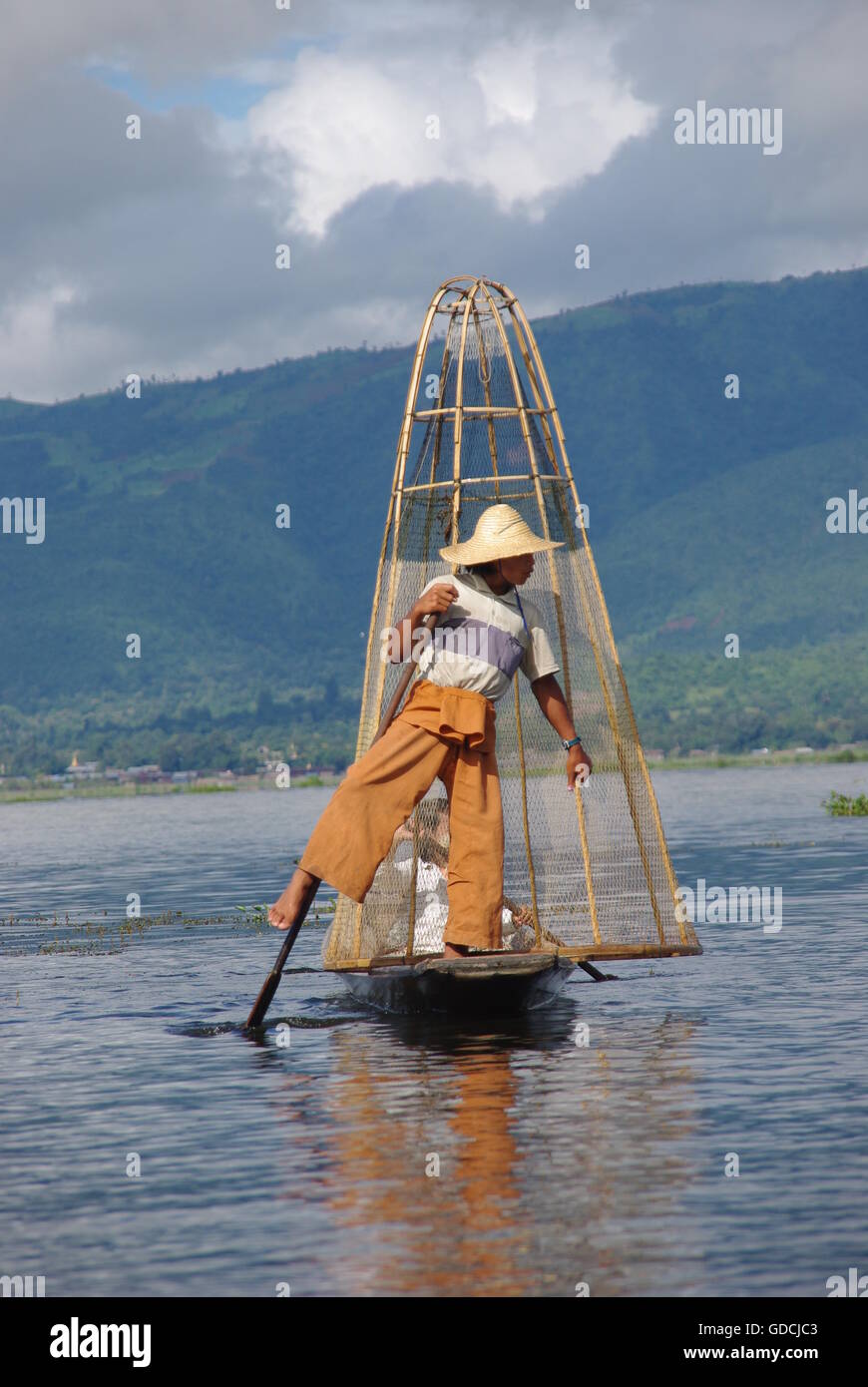 Fisherman Rowing with one leg on Inle Lake, Myanmar Stock Photo