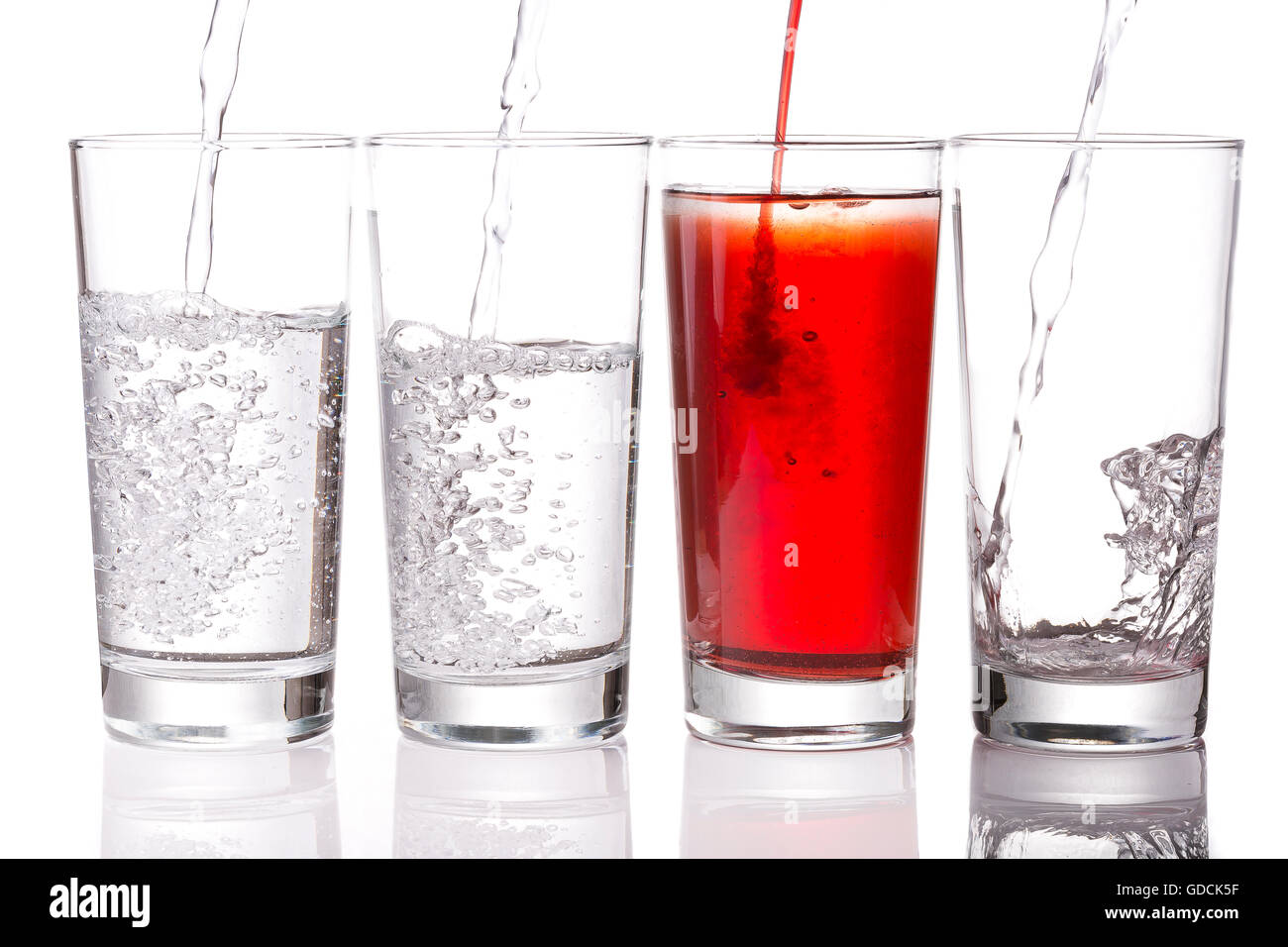 Pouring Squash and Water into Glasses Stock Photo Alamy