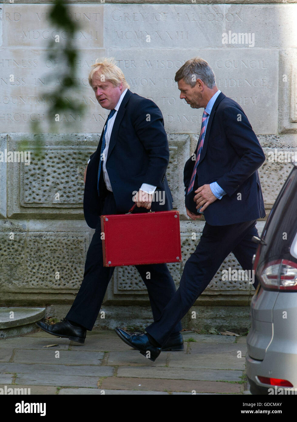 Foreign Secretary Boris Johnson (left) arrives at the Foreign Office in Westminster, London, as at least 84 people, including several children, died after a terrorist drove a truck through crowds celebrating Bastille Day in Nice. Stock Photo