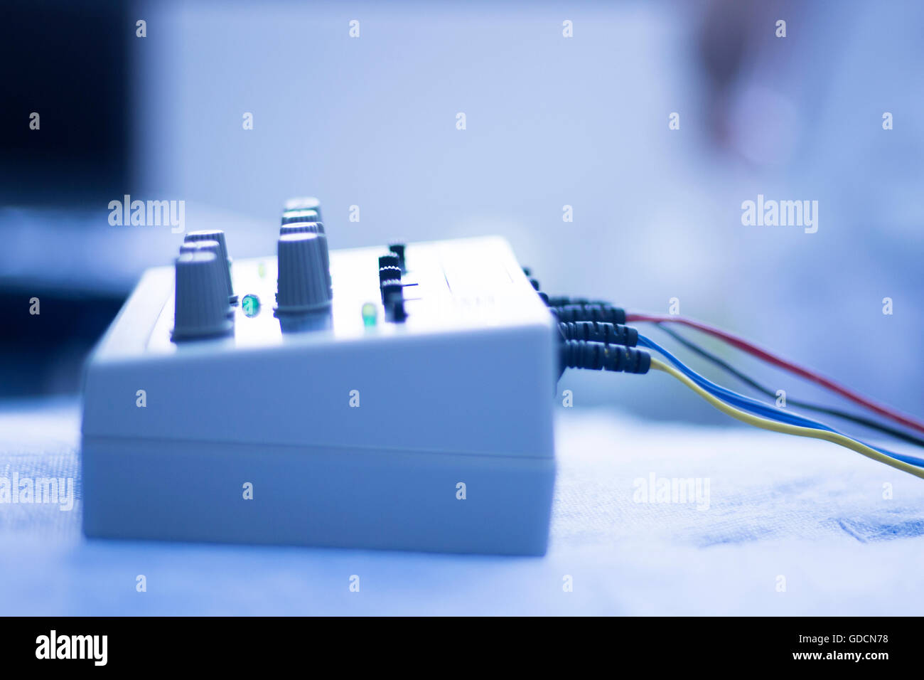 Dry needling electroacupunture cables connecting machine to needles used by acupunturist on