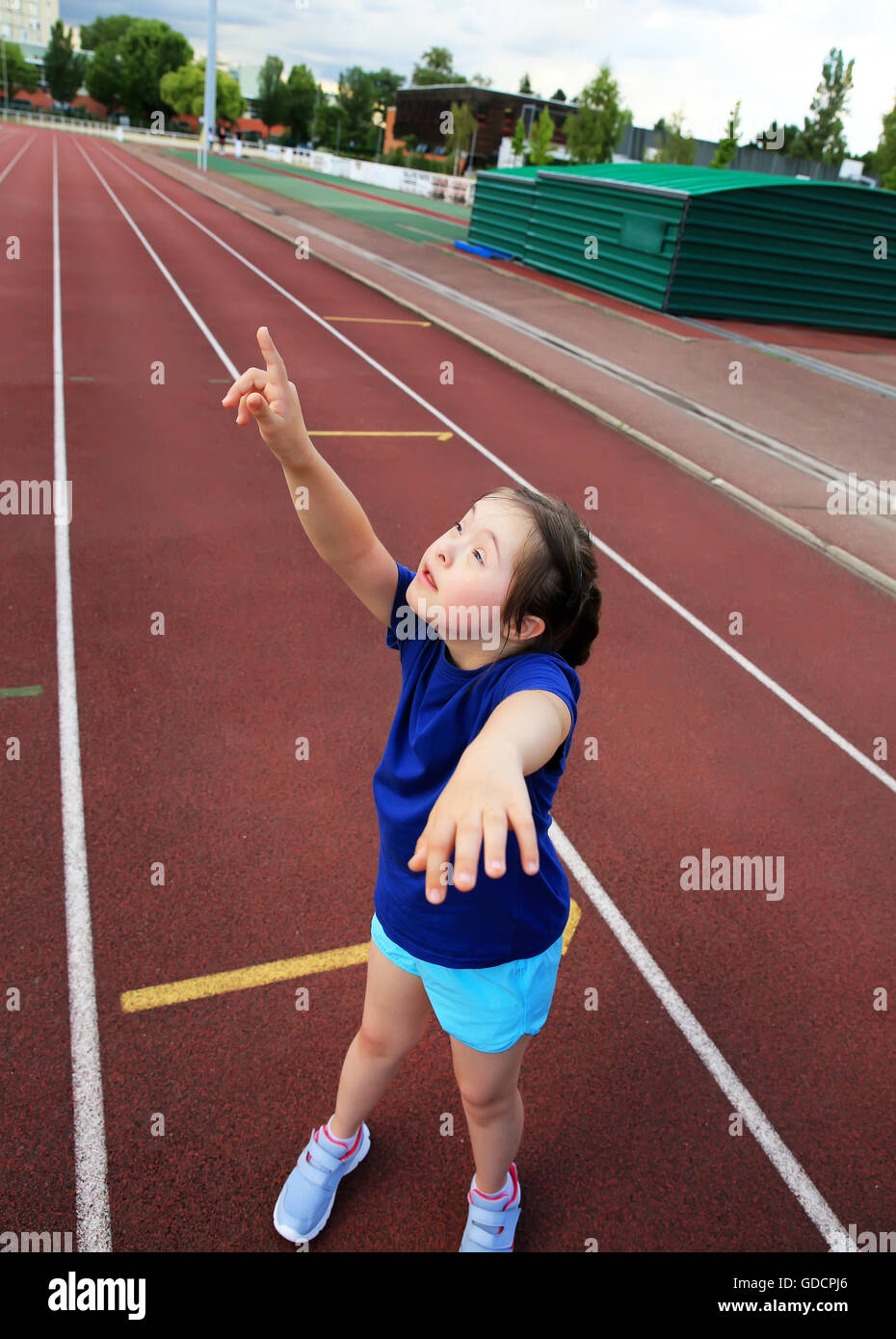Little girl have fun on the stadium Stock Photo