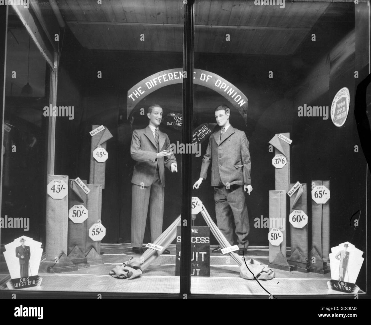 Made to measure suits in a Shop Window display for The Co-op Co-operative Wholesale Society (CWS) circa 1920 in the Burton on Trent area, South Derbyshire. Photograph by Tony Henshaw Stock Photo