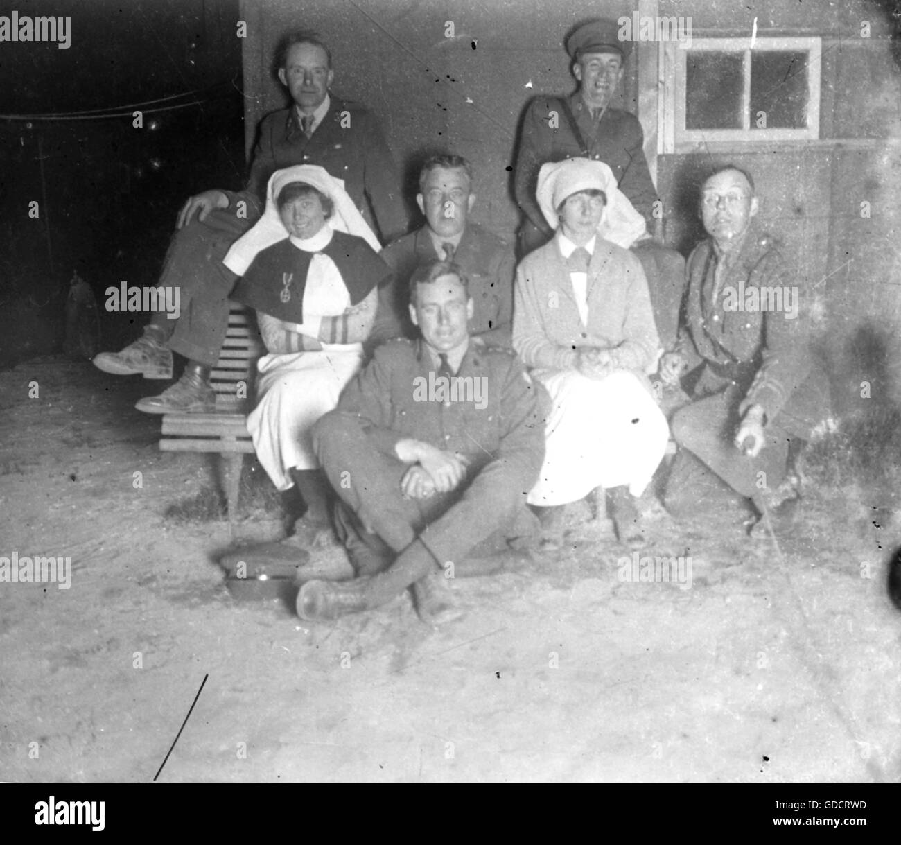 Scenes at the end of the 1st World War c1918/1919  Members of the RAMC including nurses pose for a flashed photo taken by the officer to the right - note the remote control device. This man is likely to be the author of this set of photographs.  Photo by Tony Henshaw       Scanned direct from a stereo original negative from a rare archive record of original photography from a British Doctor photographing at the end of World War 1    © World copyright. Stock Photo
