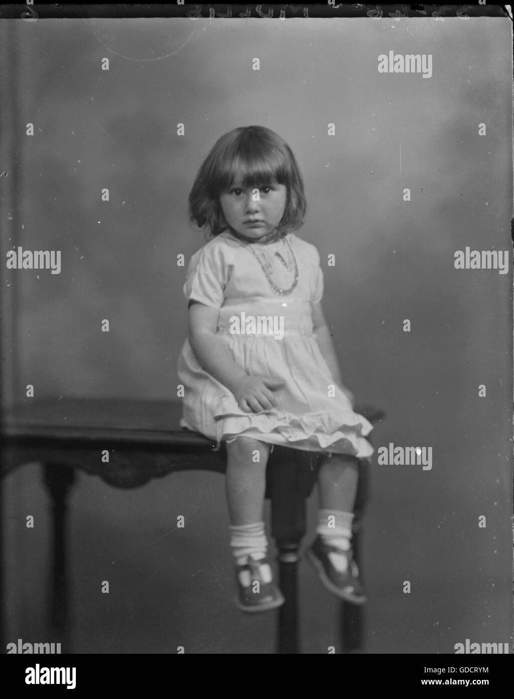 Little girl studio photo name of Mollis or Mollie.c 1920. Photograph by Tony Henshaw Stock Photo