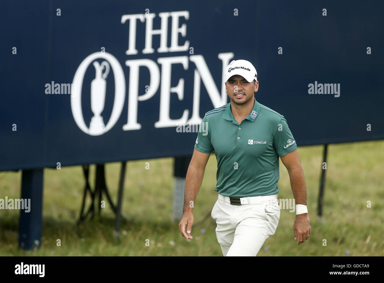 Australia's Jason Day walks past signage on the way to the 8th green ...