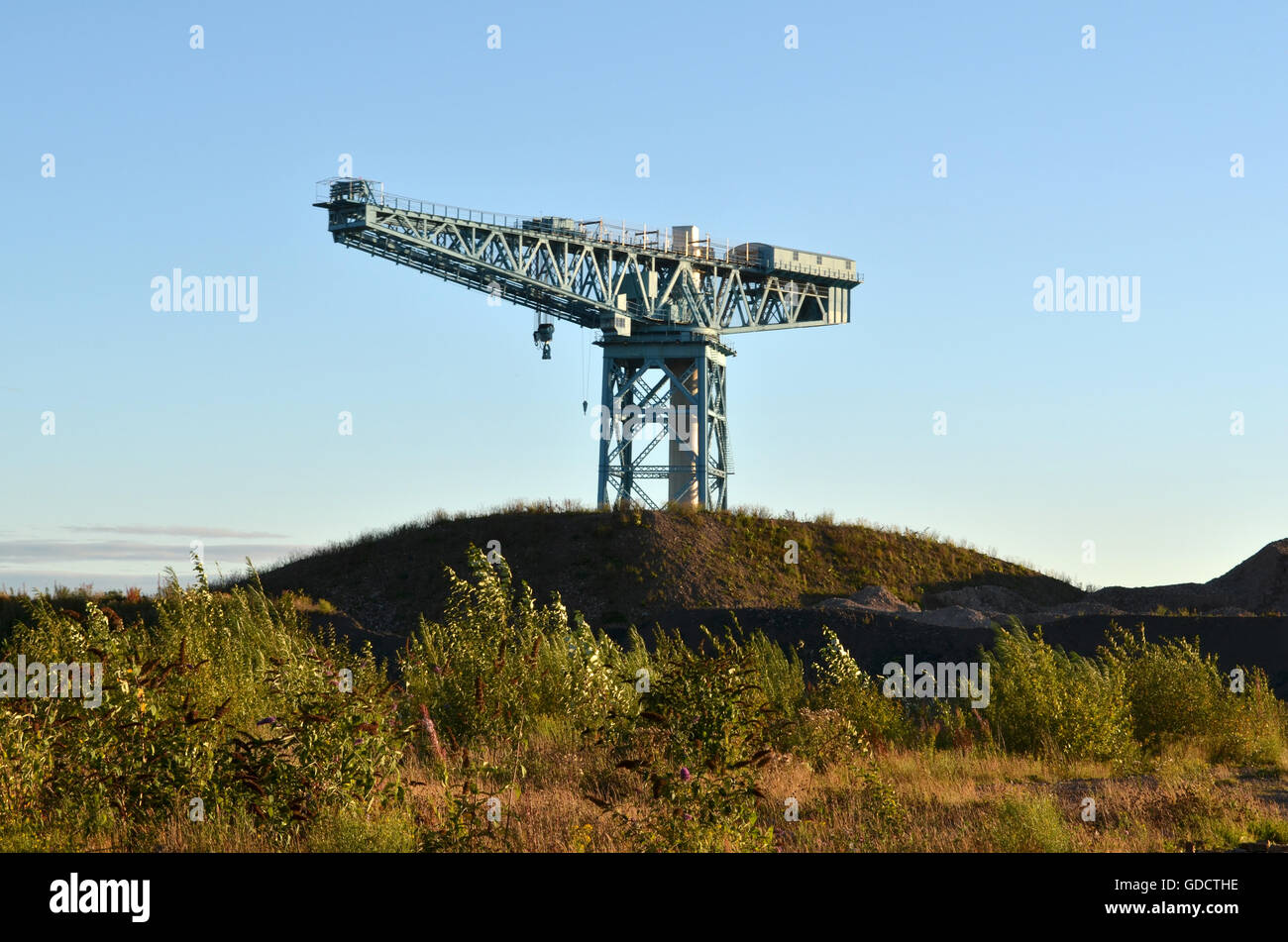 Waste Ground. The Titan Crane on the site of the former John Brown's shipyard in Clydebank surrounded by piles of demolition rubble. Stock Photo