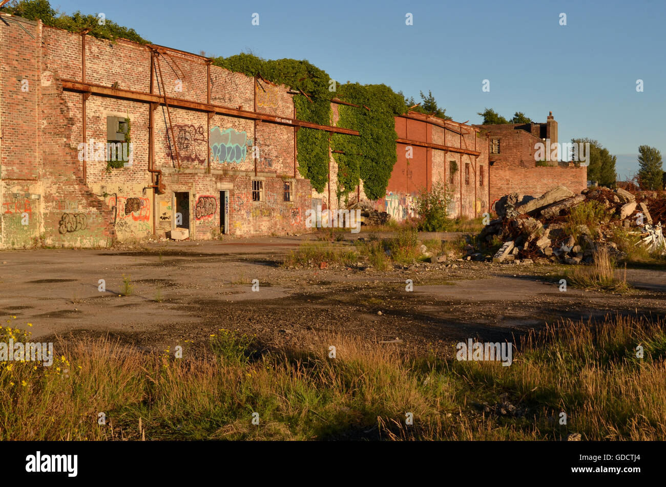 Derelict Shipyard Wall of the once famous John Brown Shipyard, now just waste ground Stock Photo