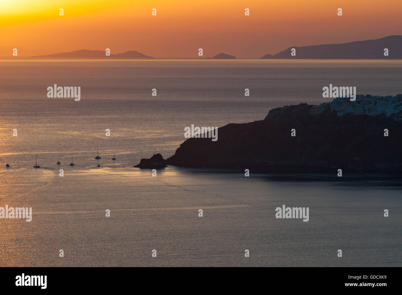 Greek sunset over Aegean, Santorini Stock Photo