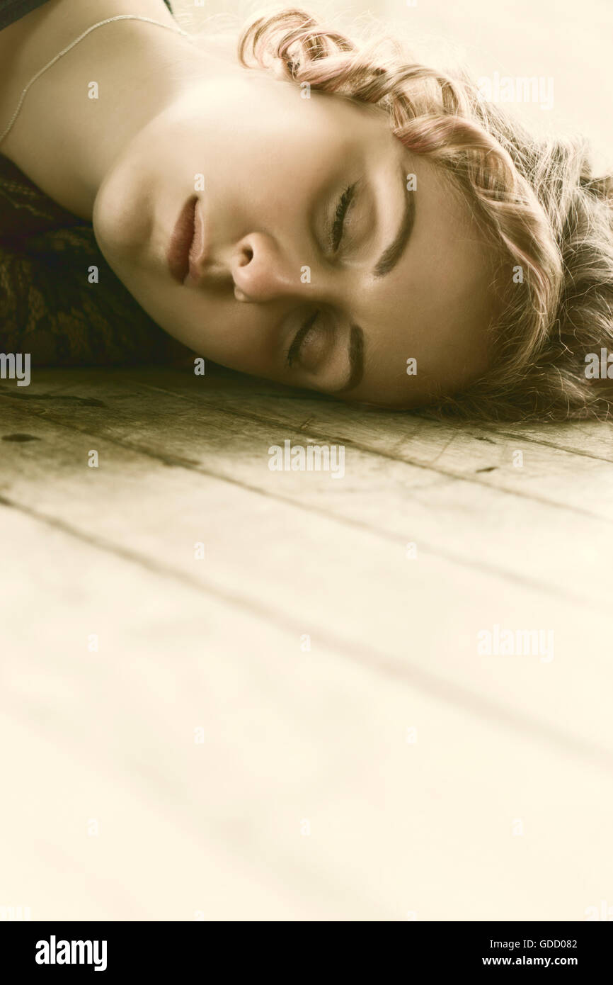 Portrait of a woman laying on the floor Stock Photo