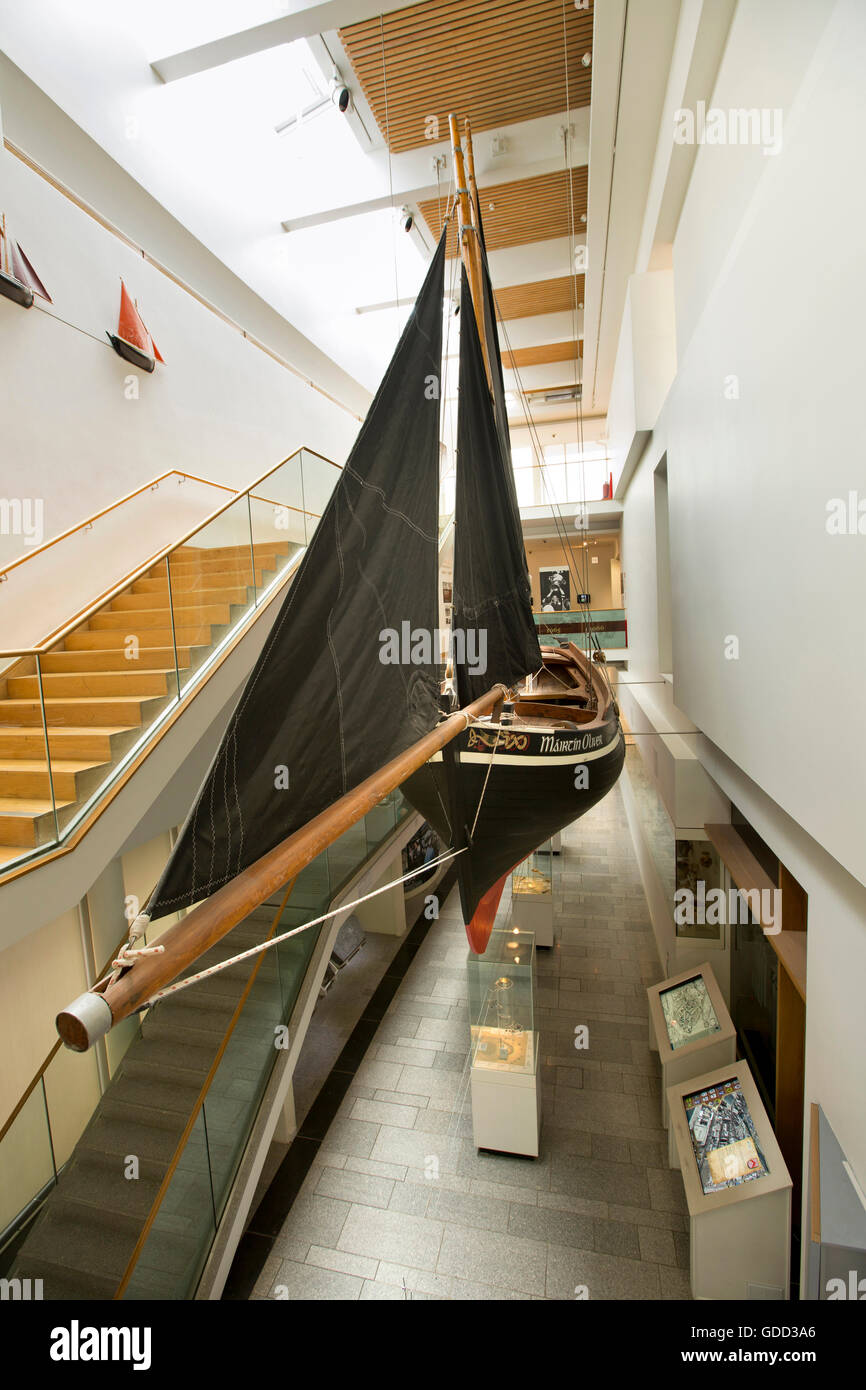 Ireland, Co Galway, Galway, City Museum, Galway Hooker, the Mairtin Oliver, suspended over stairwell Stock Photo