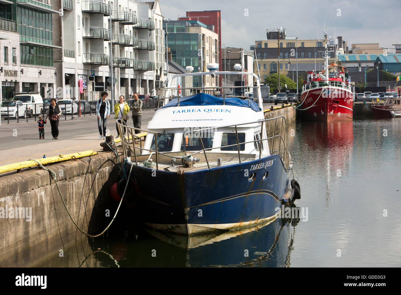 Ireland, Co Galway, Galway, Dock Road, fishing trawler and excursion tour boat Tarrea Queen moored in Dock No 1 Stock Photo