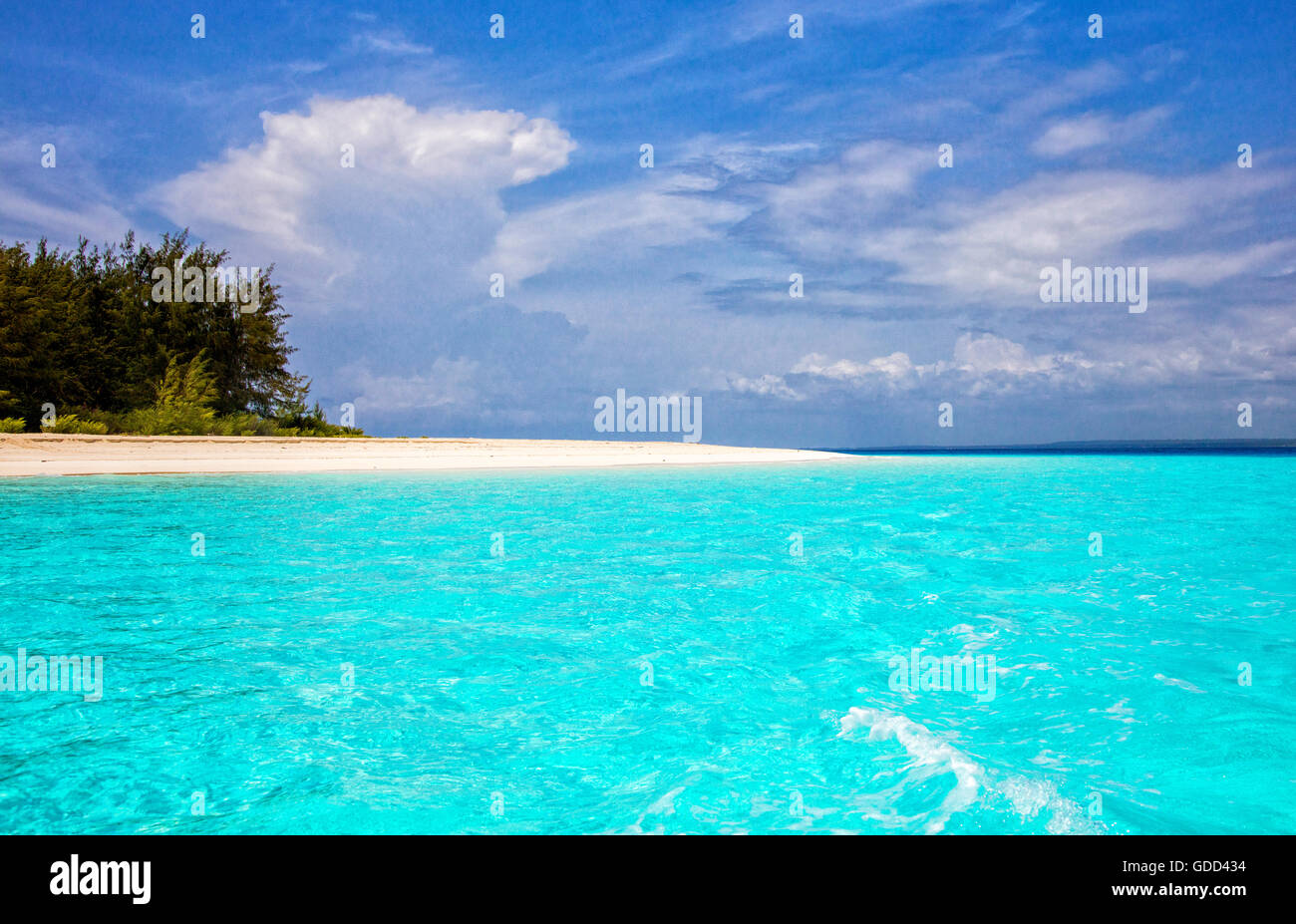 Turquoise seas off the white powder sand beach at Mnembe Island off the coast of Zanzibar East Africa Stock Photo