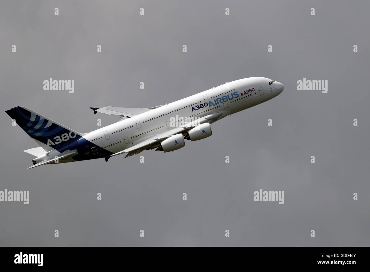 An Airbus A380 flies during the Farnborough International Airshow in July 2016. It is the world's largest passenger airliner. Stock Photo